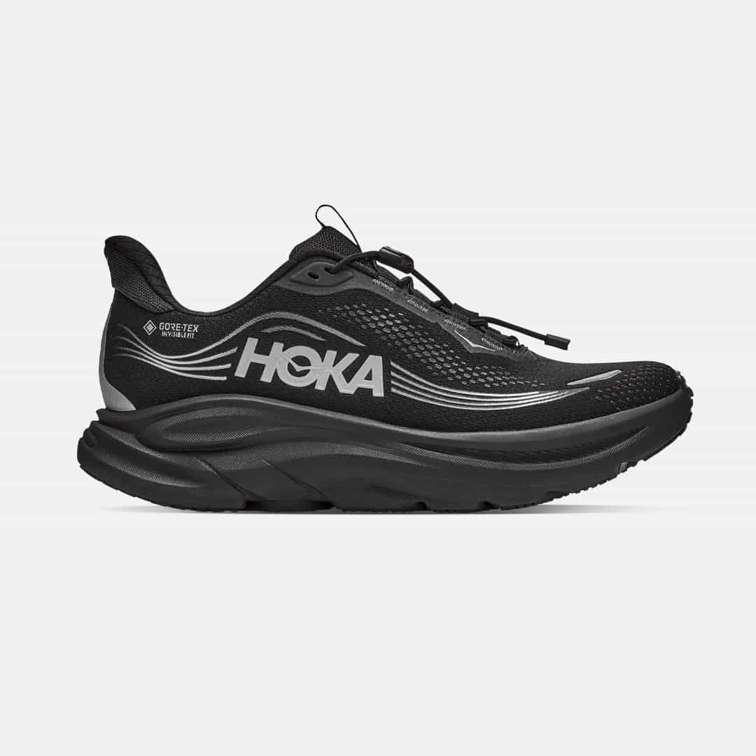 Black Hoka running shoe with Gore-Tex logo, featuring a thick sole and sleek design, seen from the side on a white background.